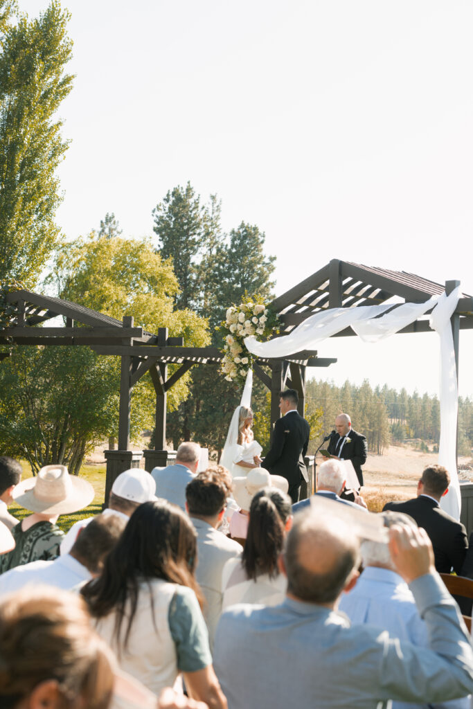 bride and groom at the alter