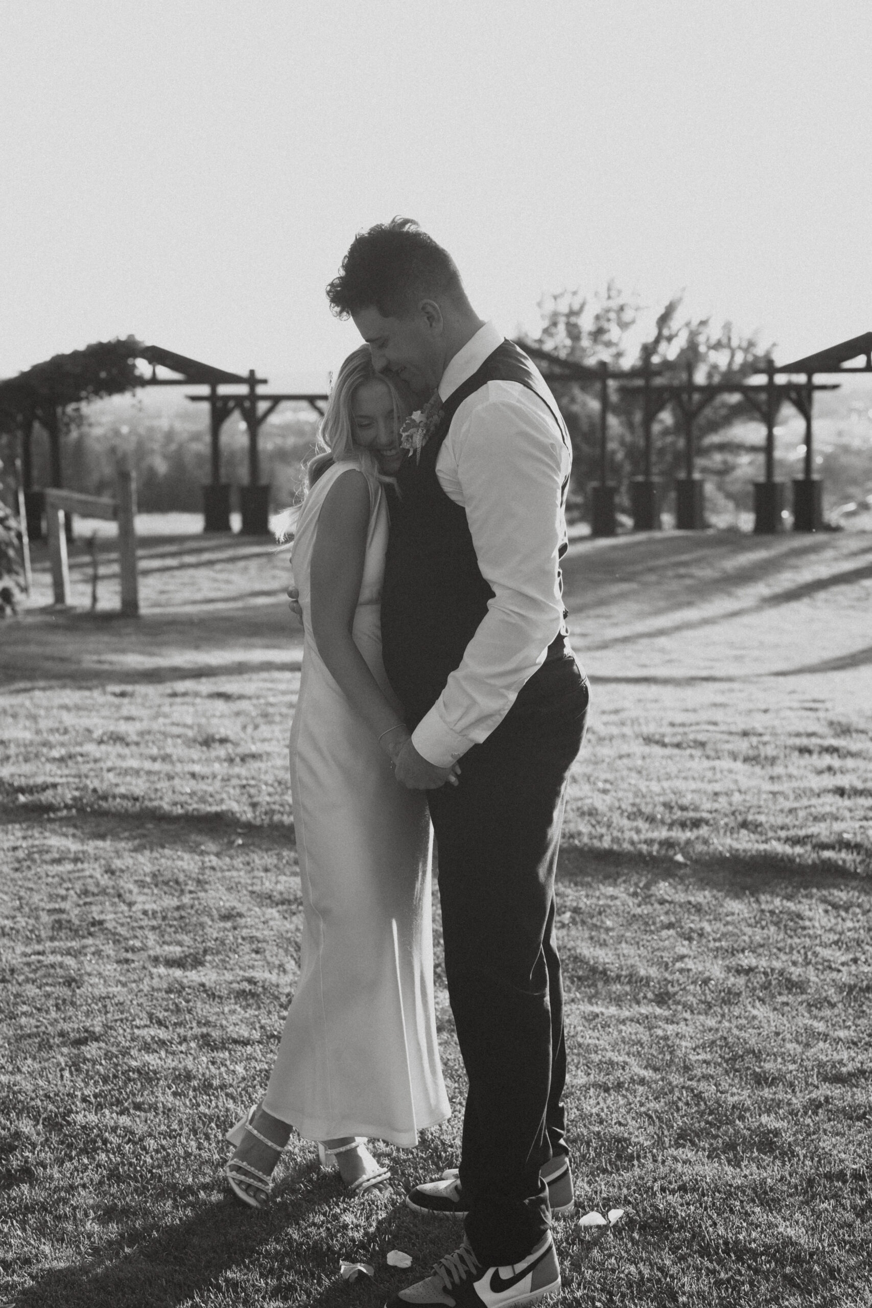 a couple embracing at beacon hill in spokane, washington