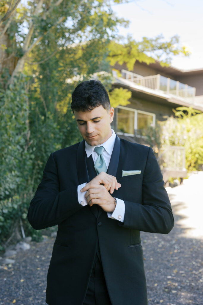 groom in a suit at beacon hill getting ready 