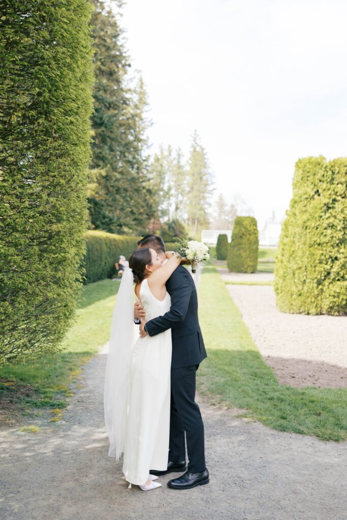 Bride and groom hugging during first look before Spokane wedding ceremony