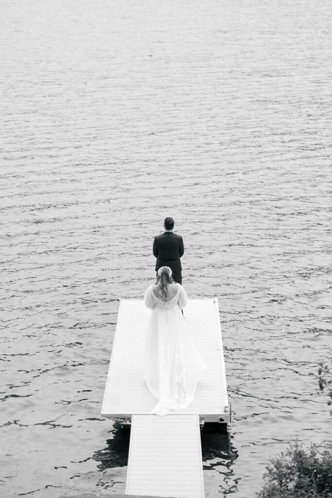 Bride approaching the groom right before their first look at Camp Twinlow. 