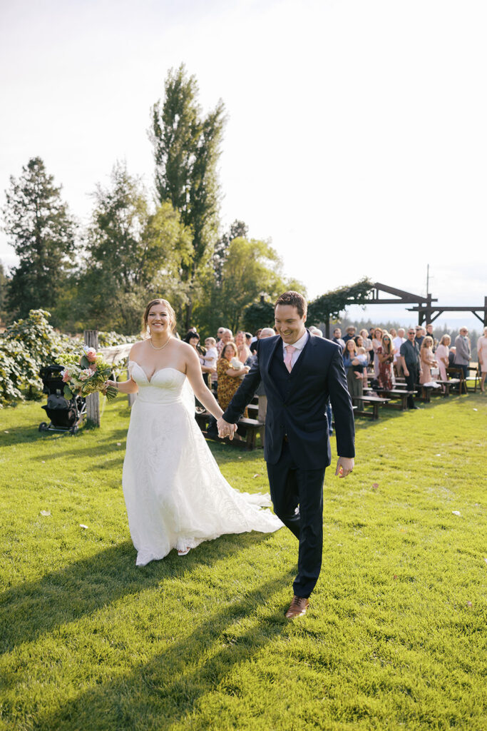 bride and groom celebrating after their wedding ceremony at beacon hill wedding venue spokane